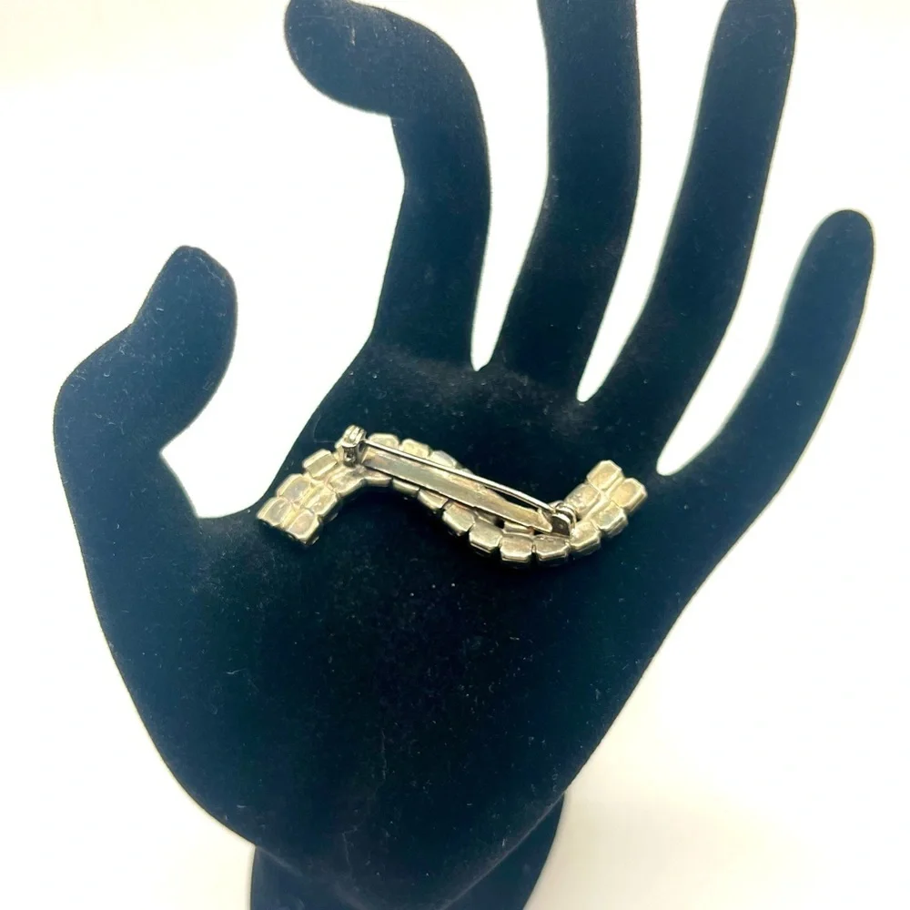 Vintage rhinestone wave brooch silver tone mid century
